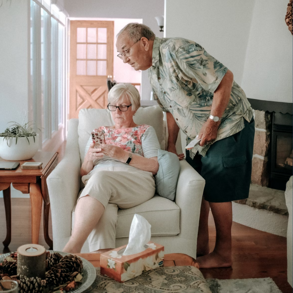 A couple looks at a smartphone together