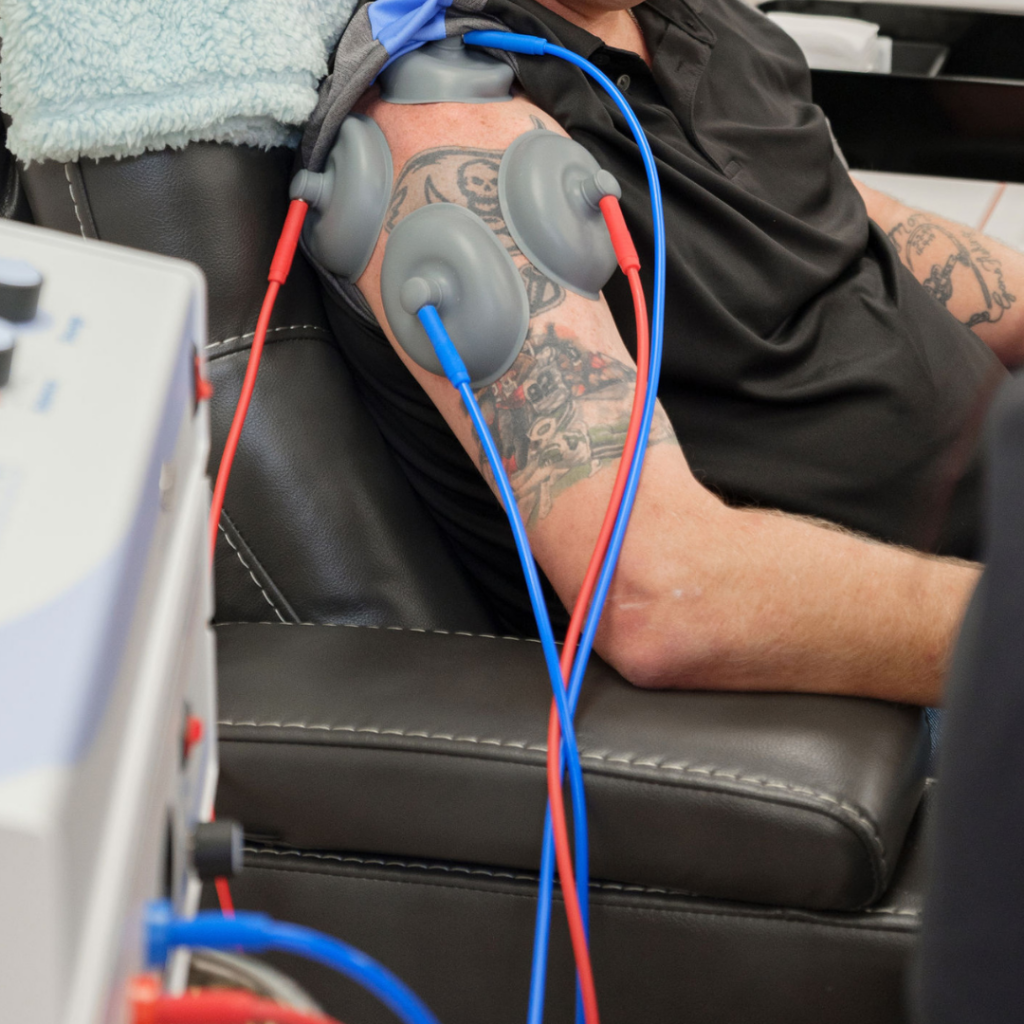 A man receives neuromodulation therapy from Nerve Renewal clinic